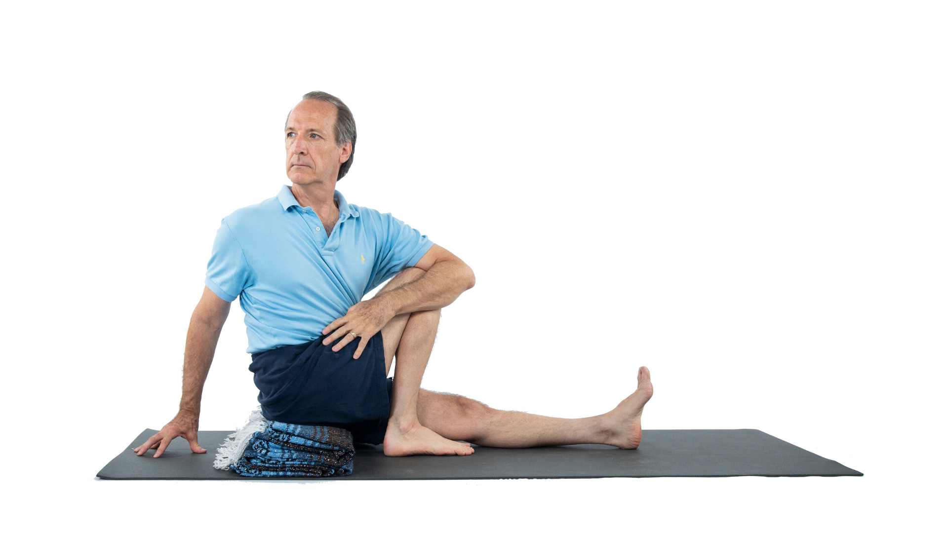 Man practicing yoga Sage's Pose (marichyasana)