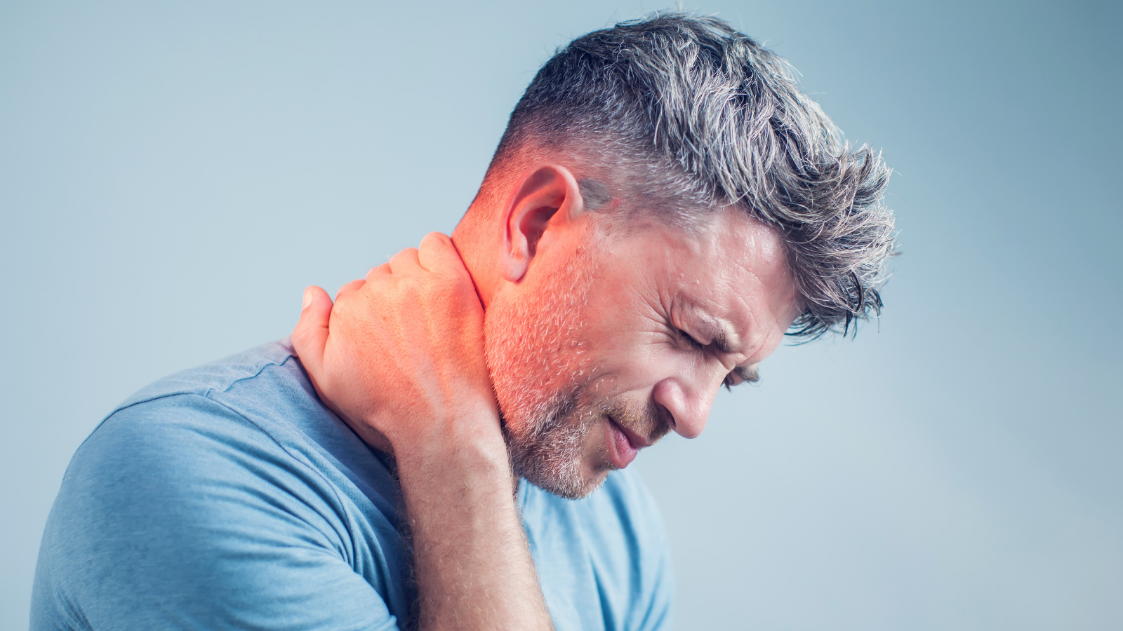 Young man suffering from neck pain or headache pain.