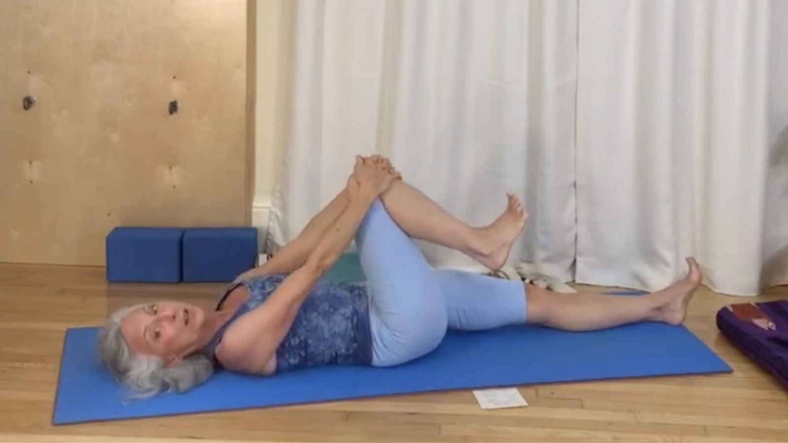 Yoga teacher practicing yoga that is healthy for the back