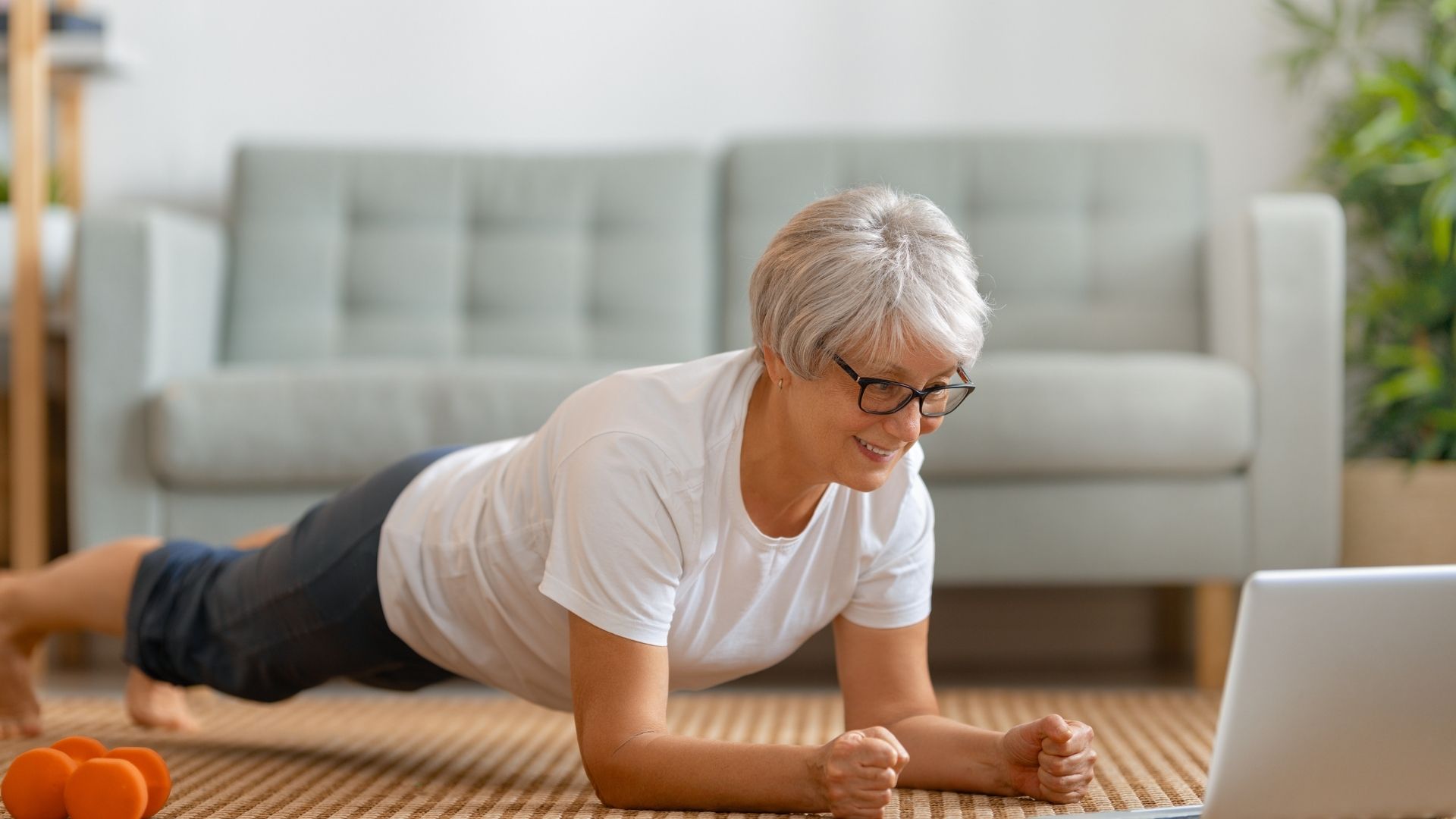 Student practicing Plank Pose as part of online 300-hour teacher training