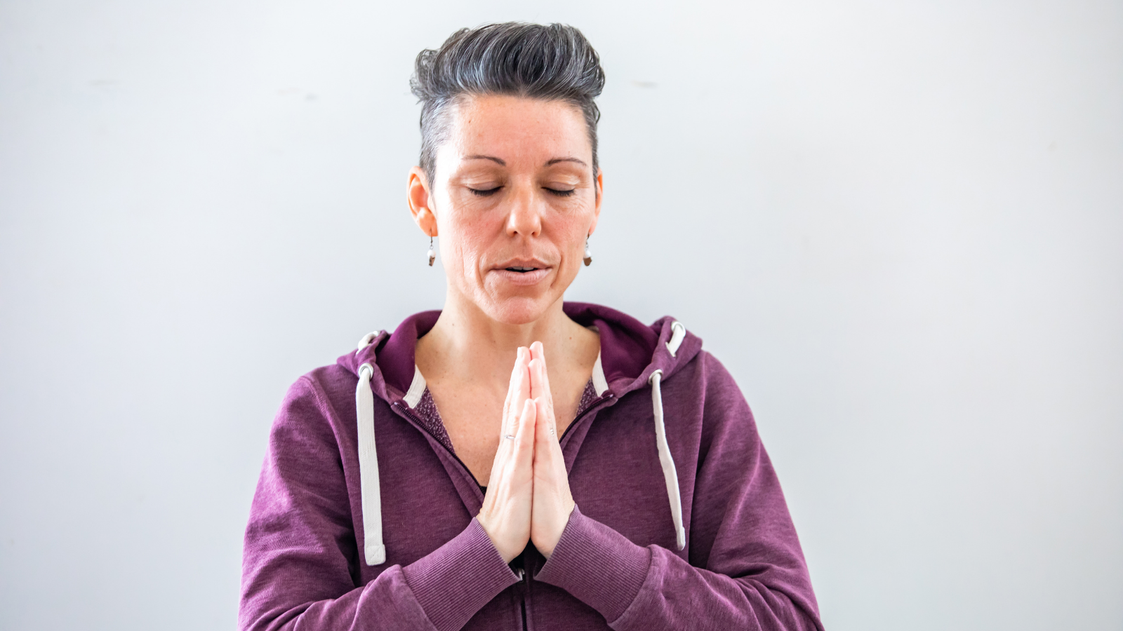 older yoga student enjoying the benefits of mindfulness practice