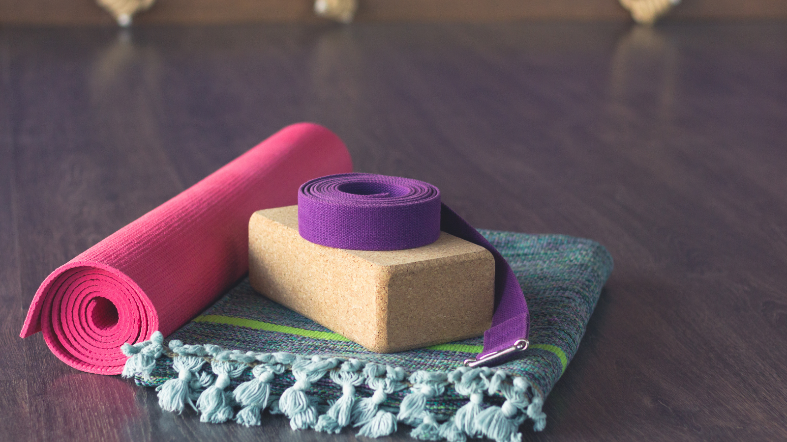 Yoga Props including a mat, blocks, strap, and yoga blanket.