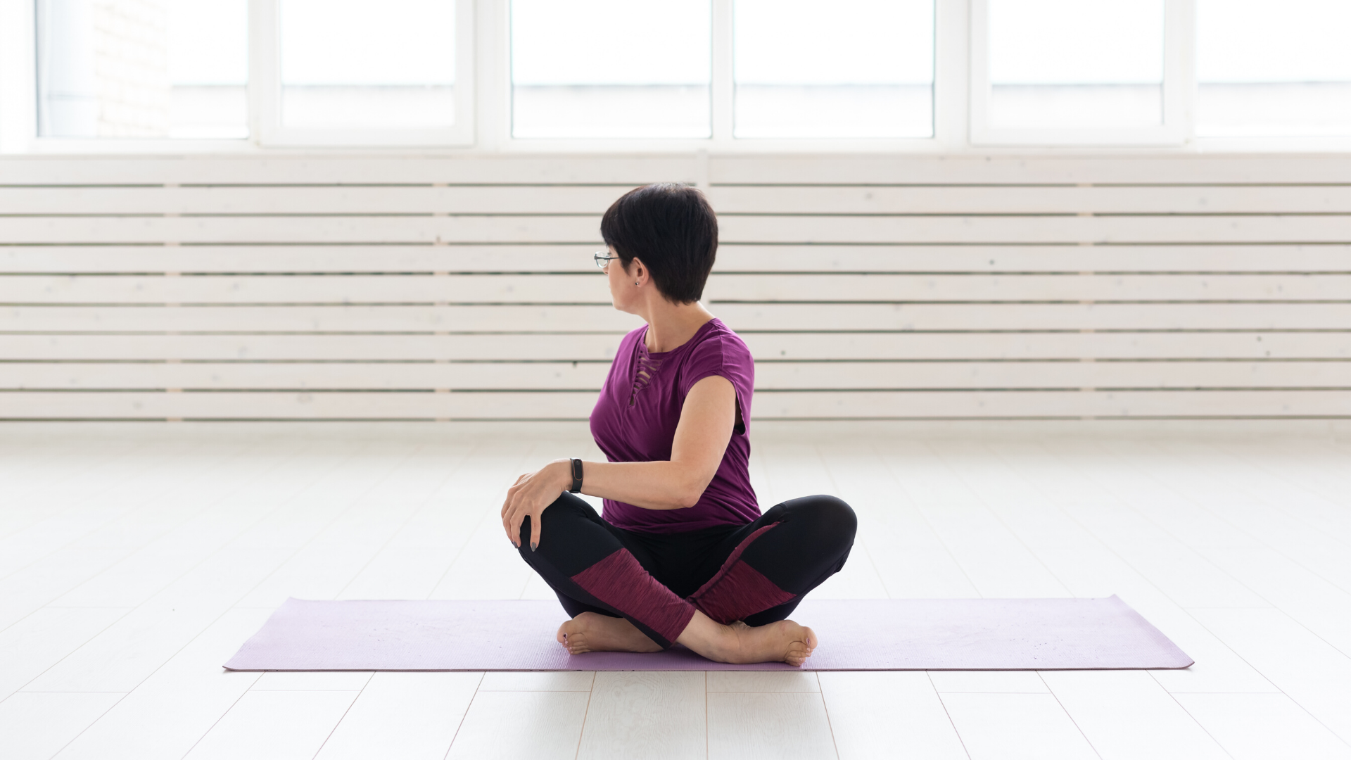 older_yoga_student_practicing_seated_spinal_twist_pose