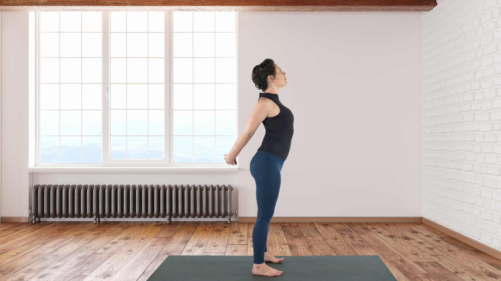 Woman practicing yoga chest opening stretch.