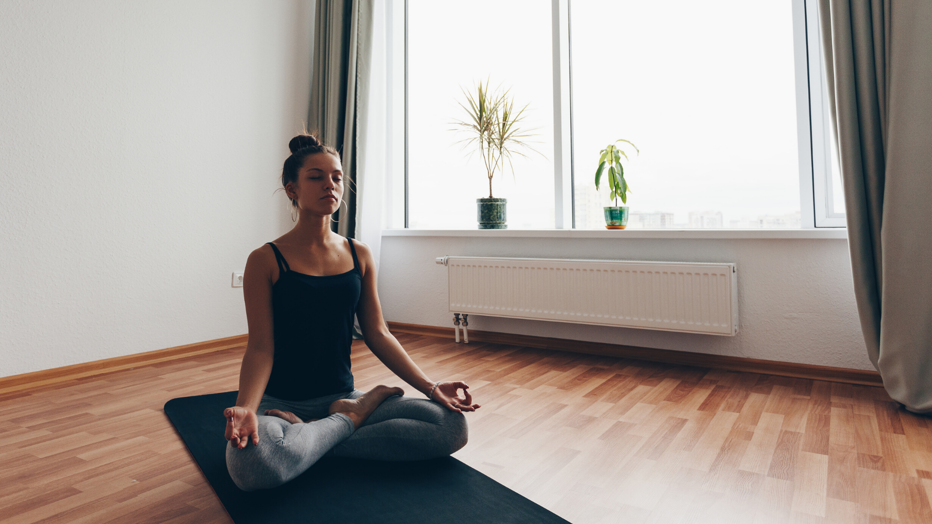 Female yoga student practicing meditation.