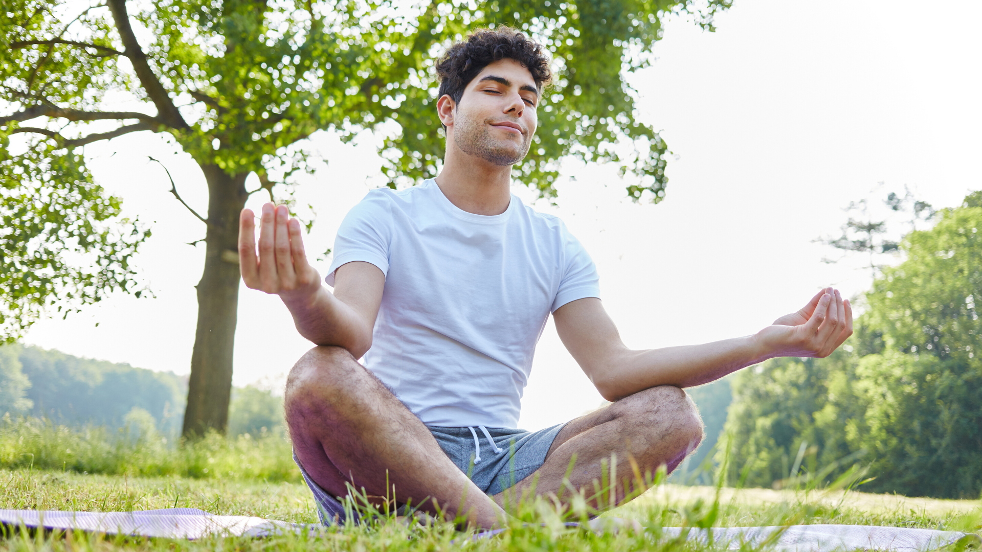 Male teenager practicing mindfulness meditation