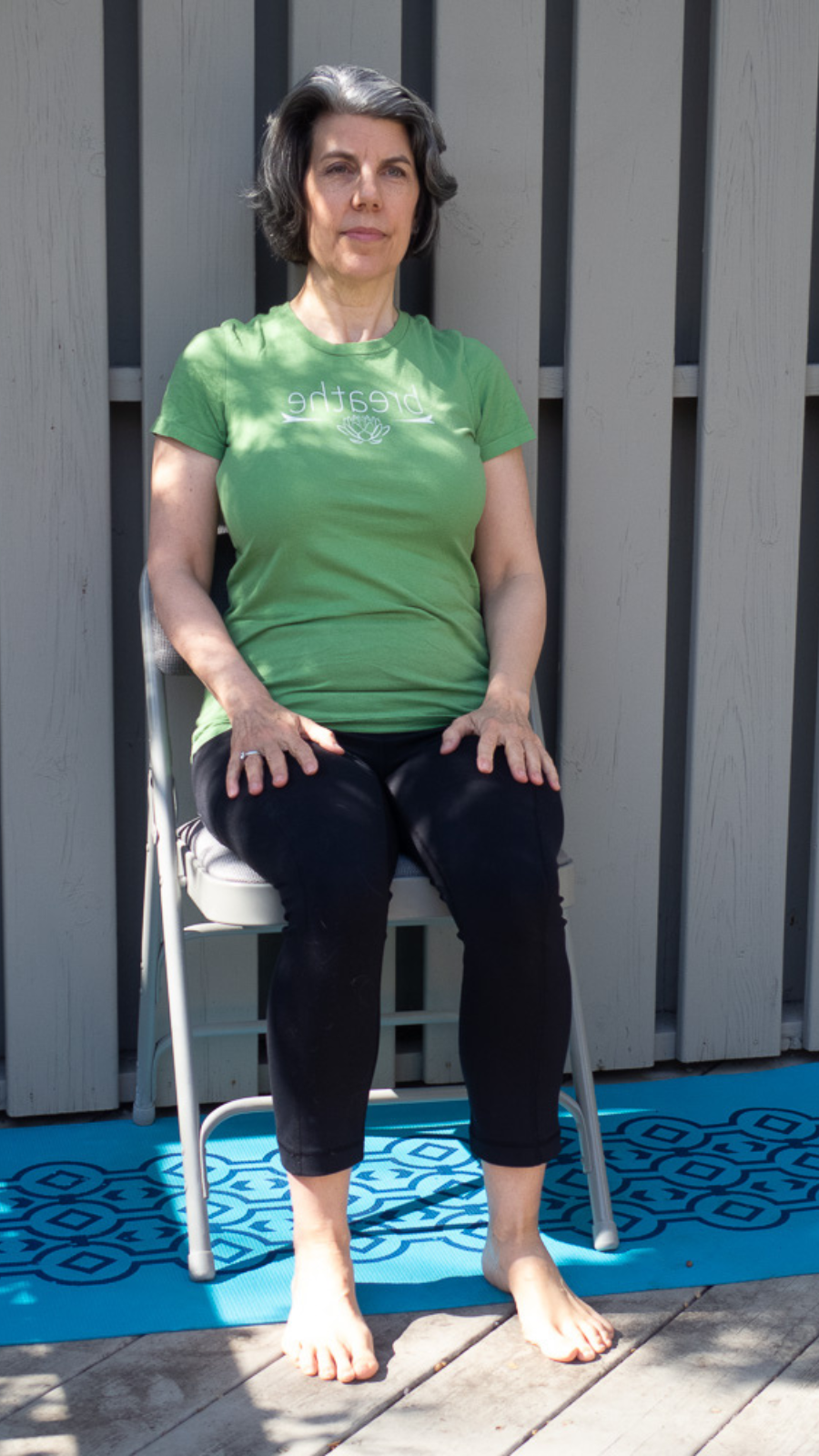 Practicing Tadasana, or Mountain Pose, the seated variation