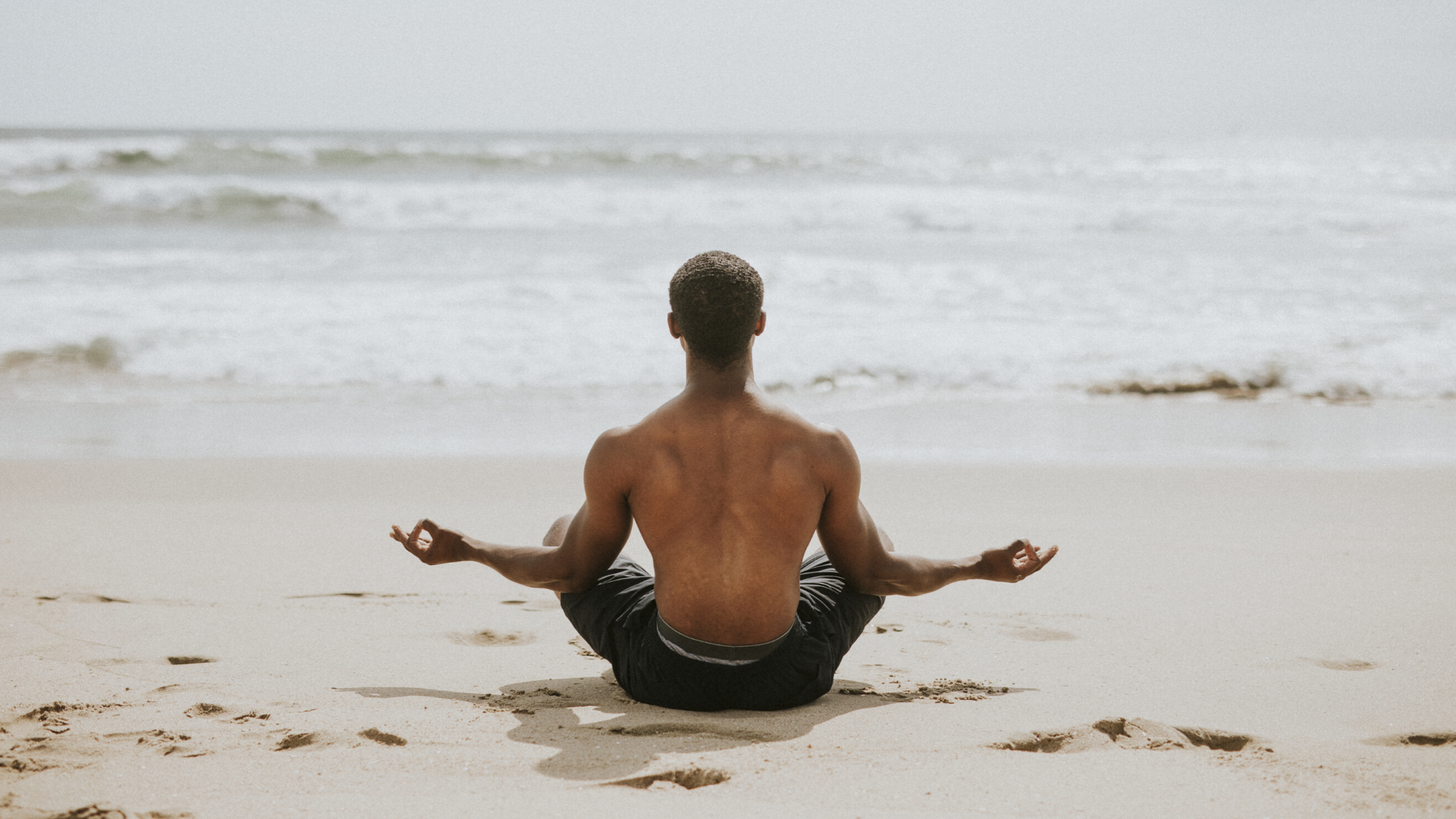 beginner_male_yoga_student_enjoying_the_benefits_of_practicing_meditation