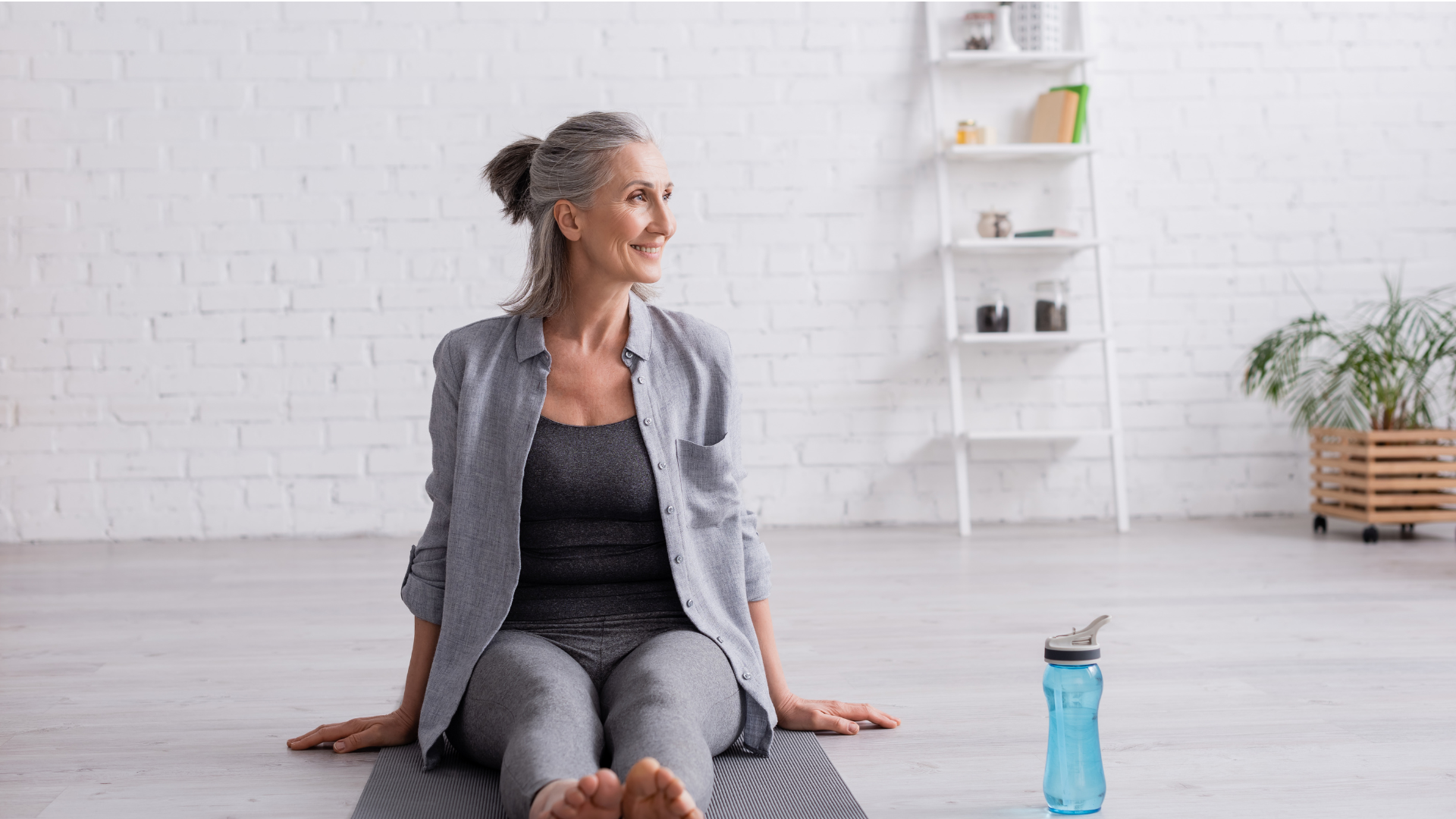 Senior woman practicing yoga at home to increase strength and flexibility and decrease immobility and pain.