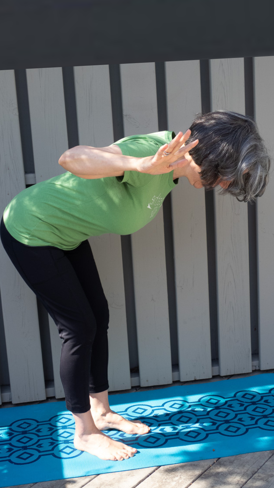 Practicing Ardha Uttanasana or half way lift-- standing version