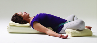 Supta Baddha Konasana, reclining bound angle pose, rest and relax pose, yoga with props