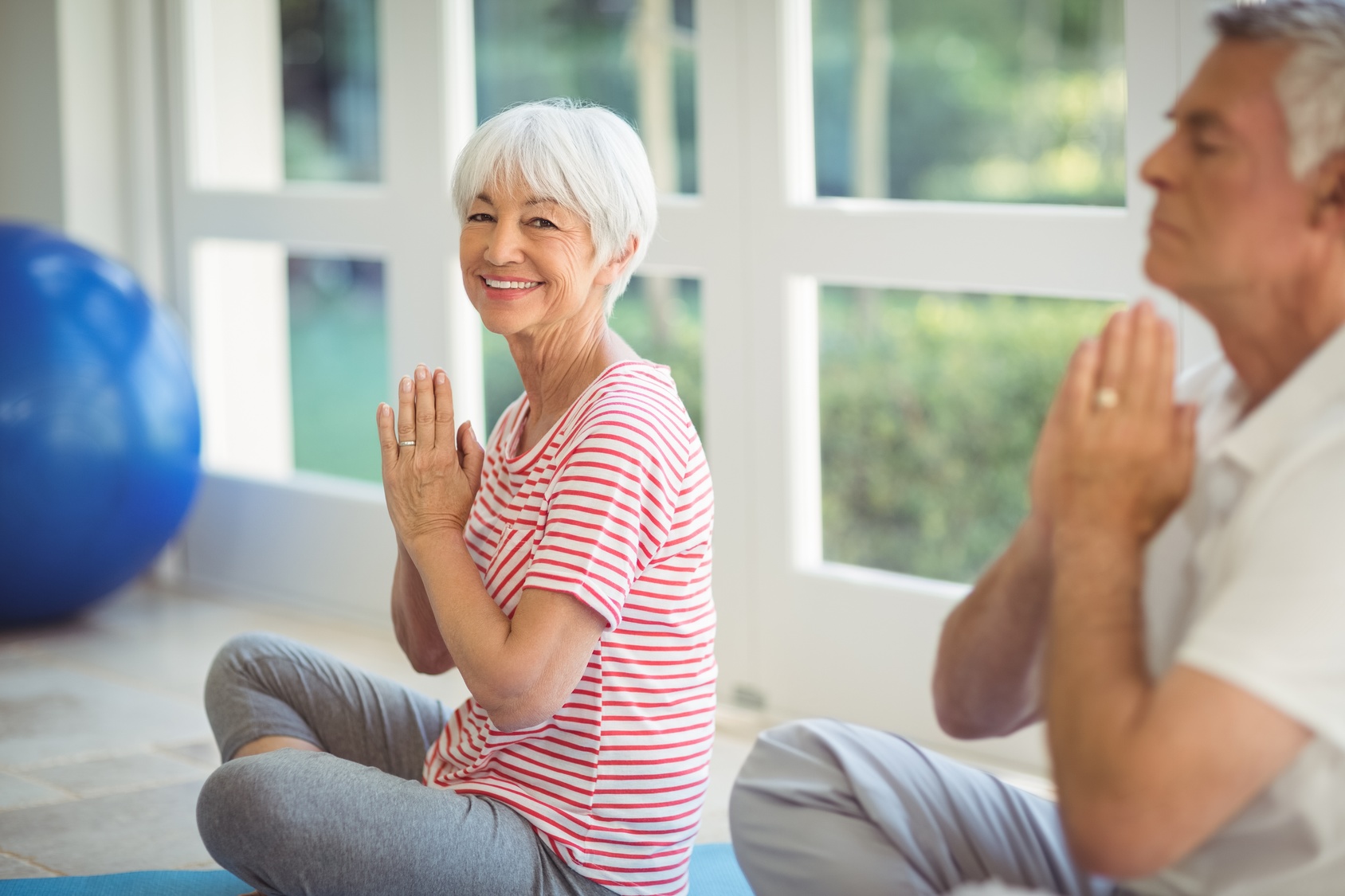 older woman practicing yoga for healthy posture