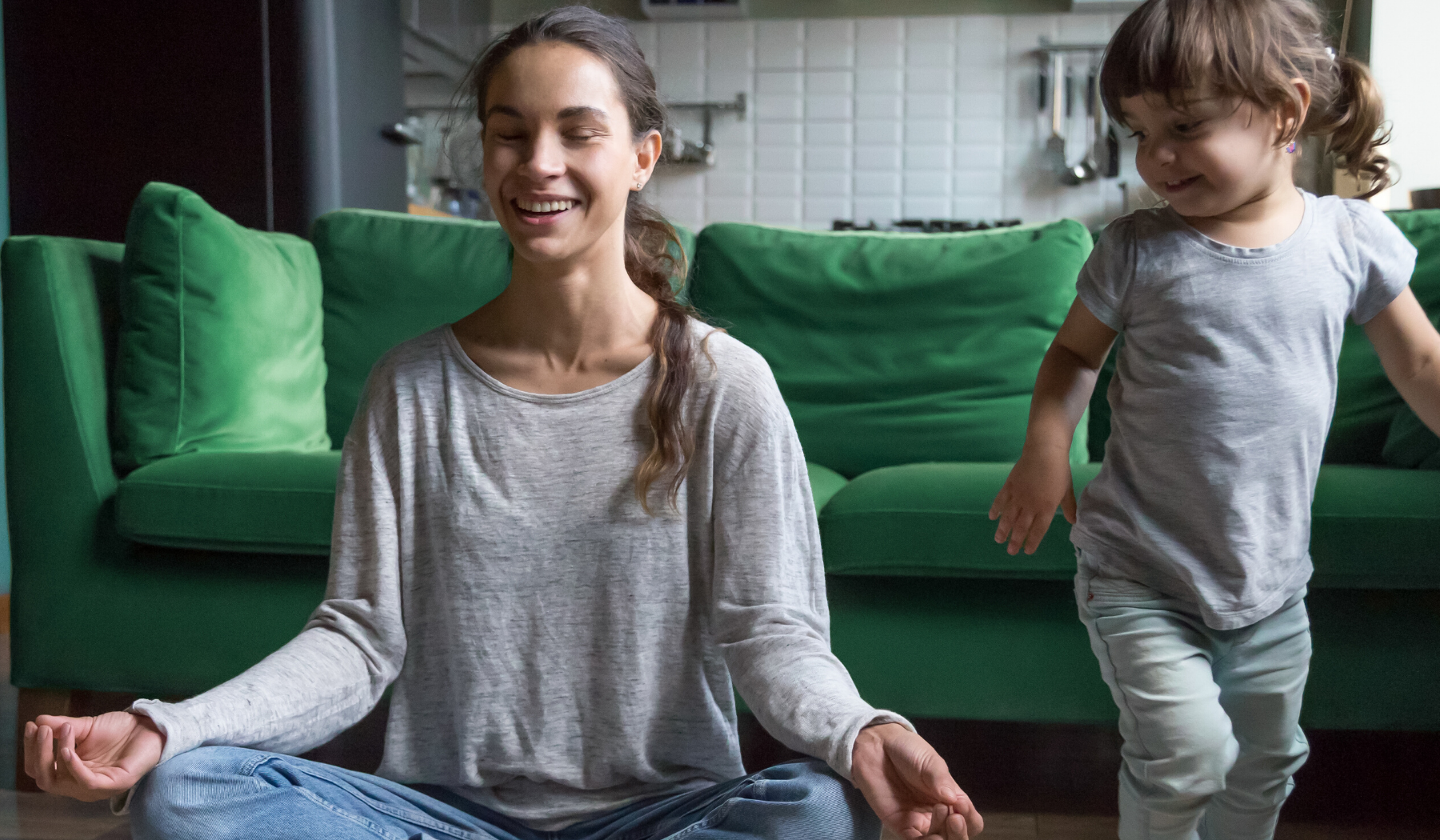 mother practicing meditation with toddler