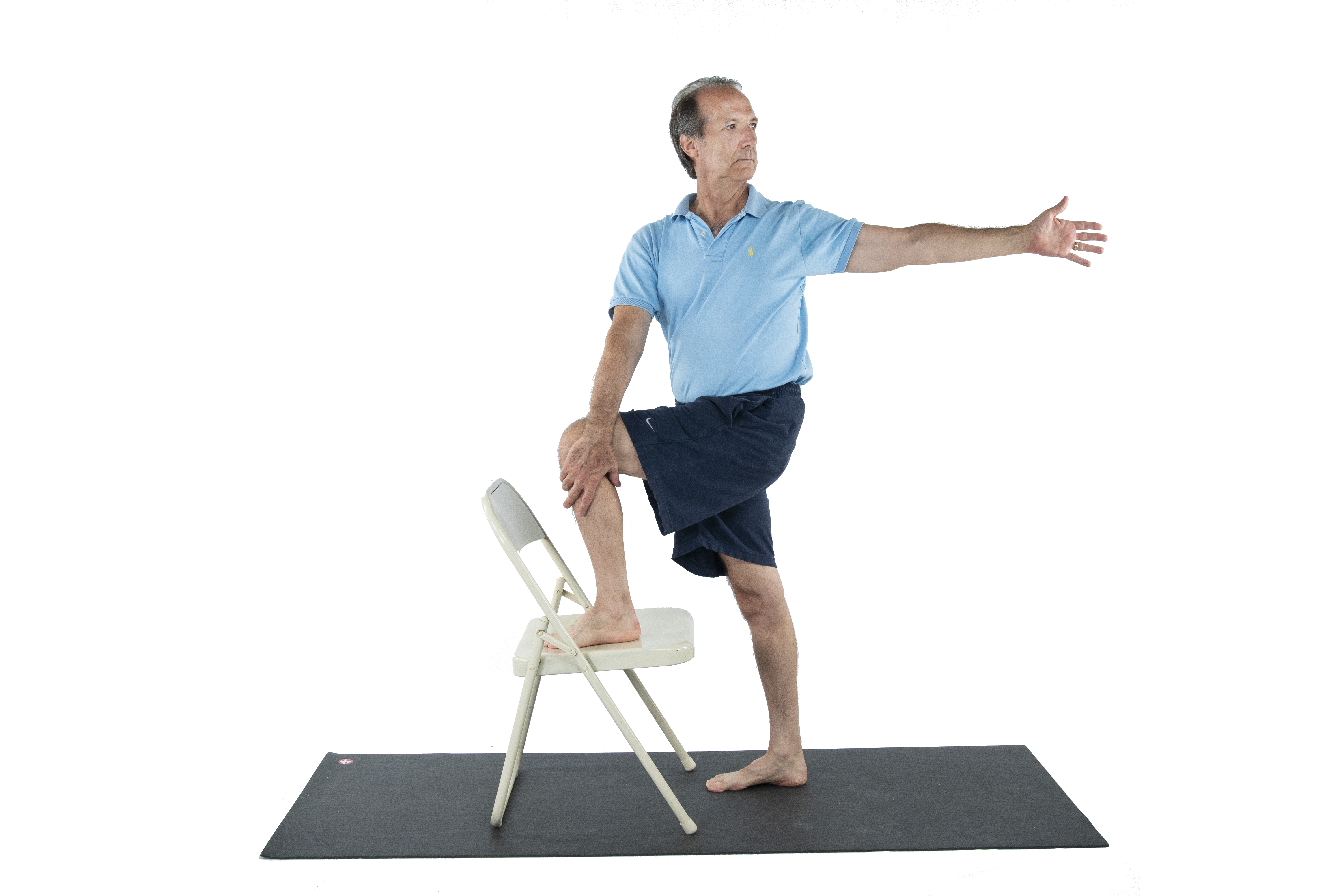 man practicing chair yoga for Alzheimer's Disease, matsyendrasana