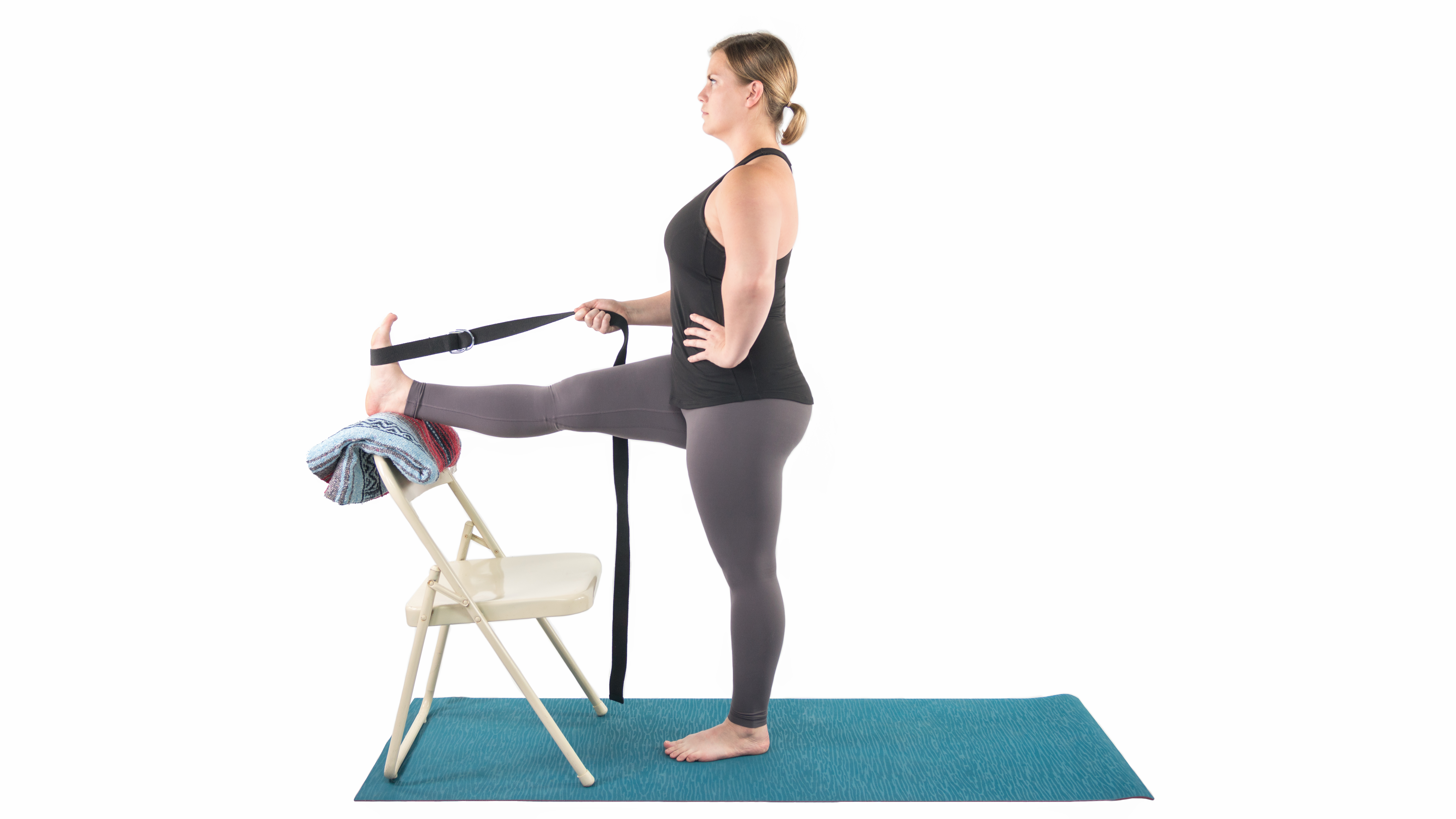 Woman in Extended Hand to Big Toe yoga pose (Utthita Hasta Padangusthasana) to practice balance in preparation for Dancer Pose