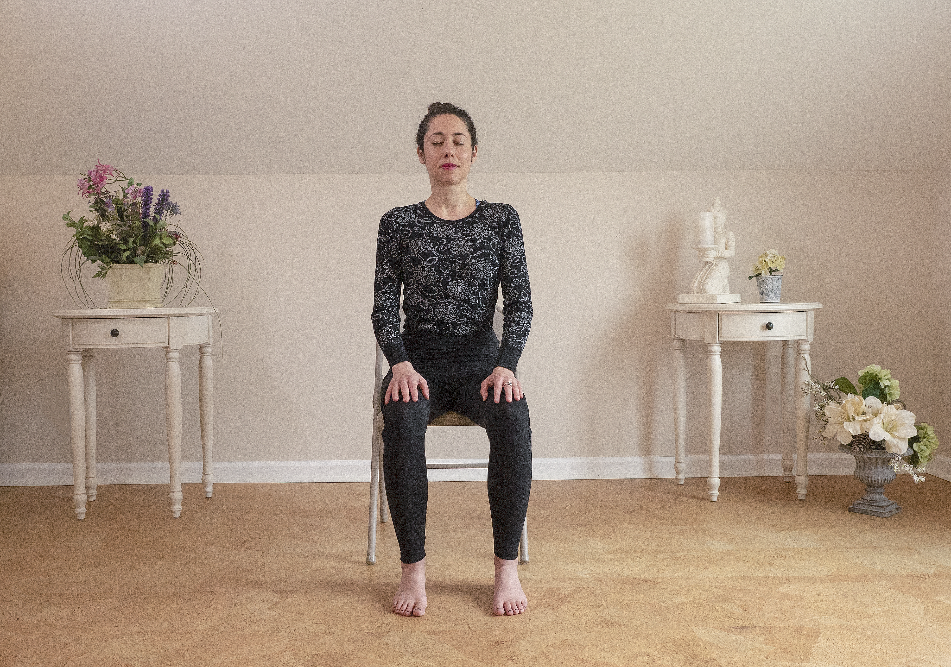 woman meditating sitting in a chair