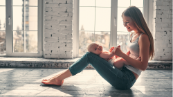 Young yoga student and mom with new baby at home