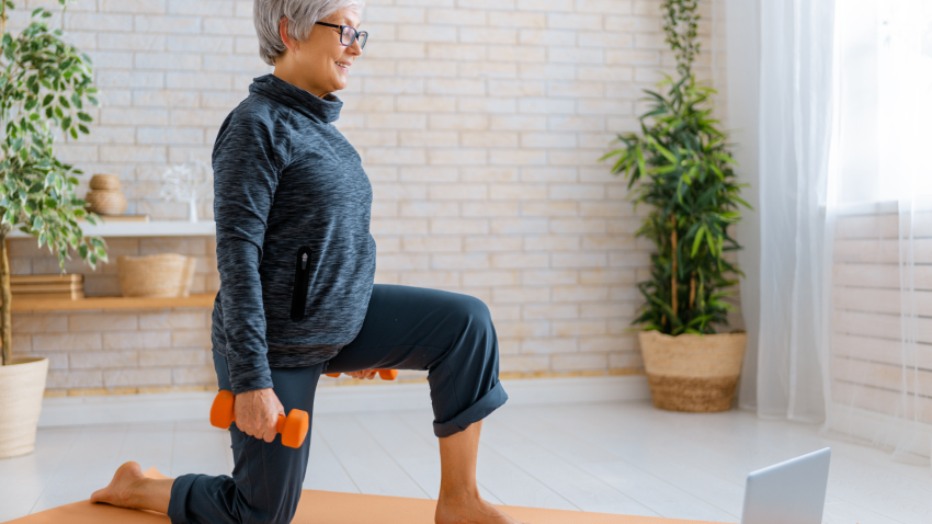 woman practicing yoga lunges while adding weights for strengthening