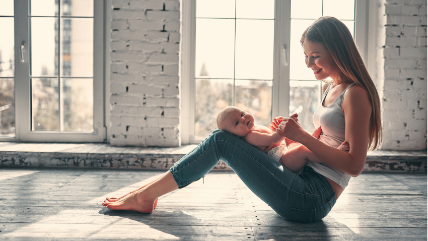 Young yoga student and mom with new baby at home