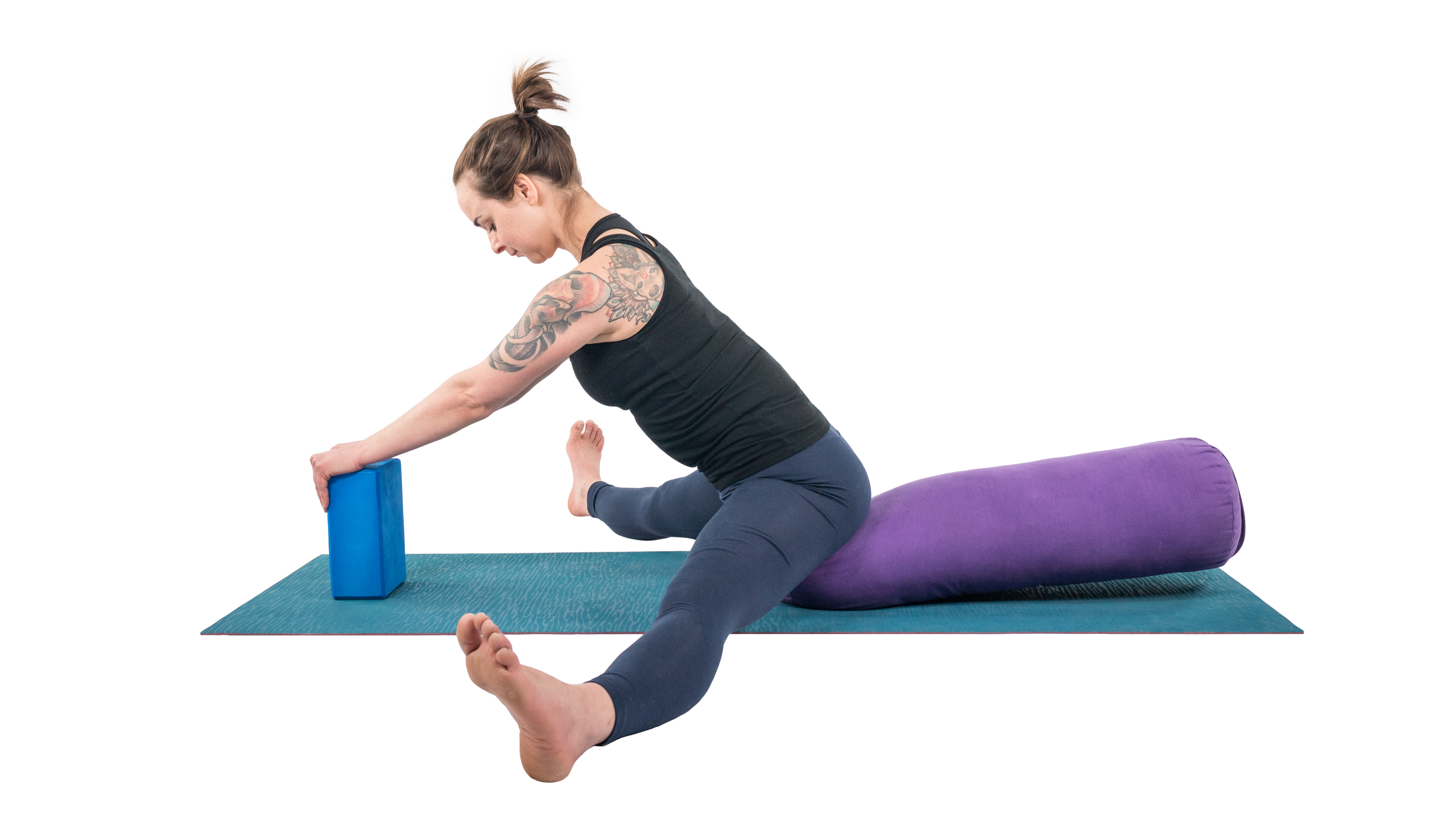 Woman practicing wide-leg forward bend in yoga upavistha konasana