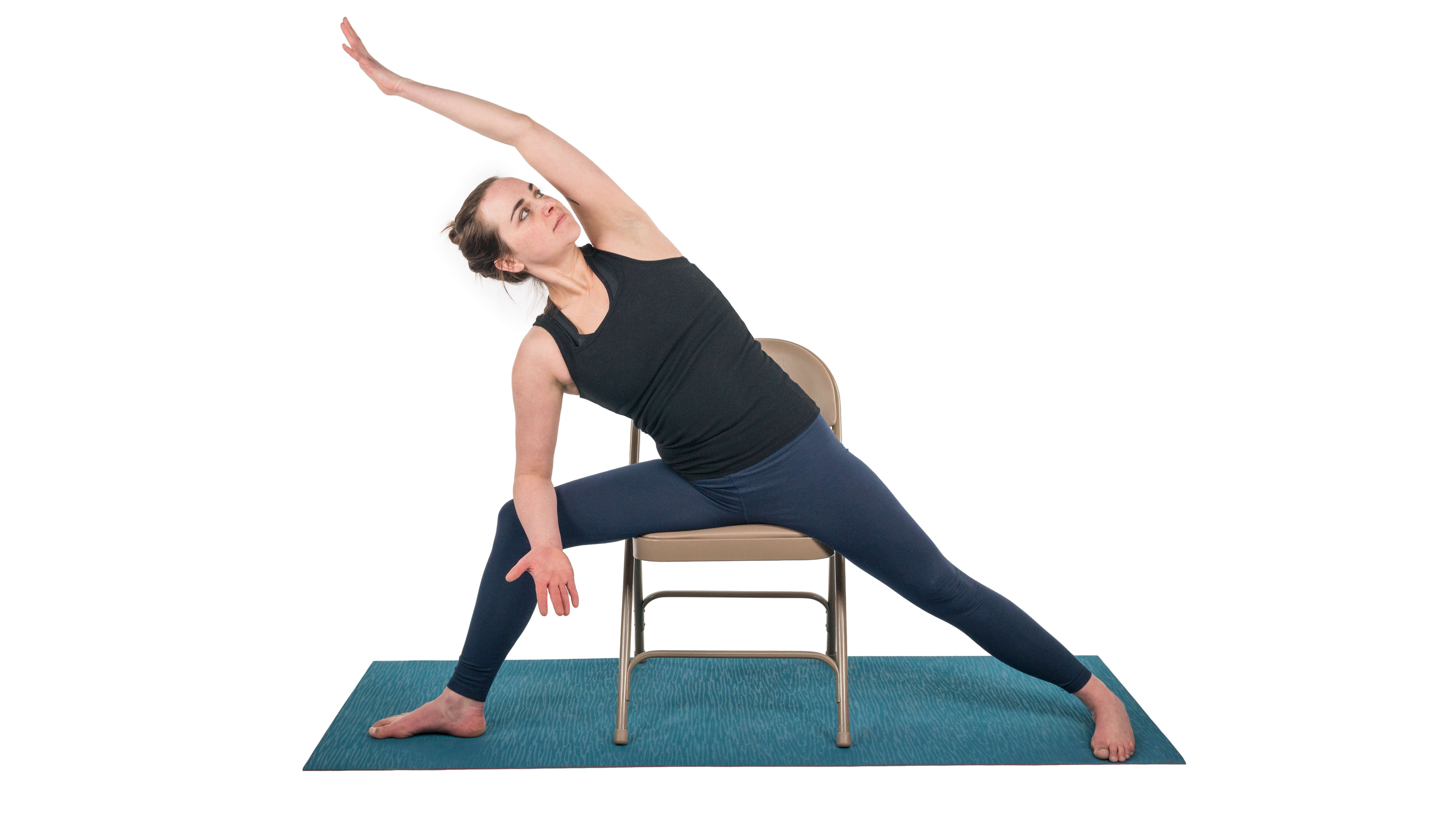 woman practicing extended side angle in a chair